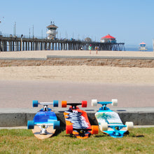 Load image into Gallery viewer, Longboard skateboards at Pier Plaza in downtown Huntington Beach.
