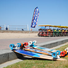 Load image into Gallery viewer, Rentals at Zack&#39;s by the Beach includes skateboards and surrey cars.
