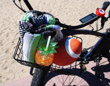 Load image into Gallery viewer, Beach bicycle basket with beach blanket, football, and refreshment.
